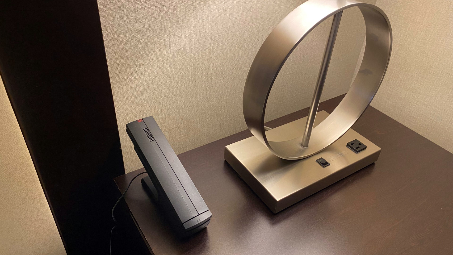 a new phone on the night stand in a Statler Hotel room