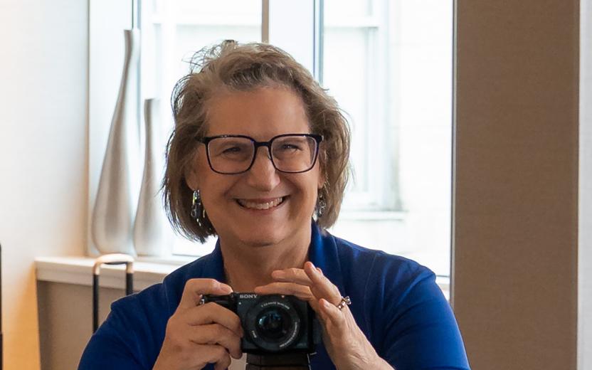 a woman taking photos at an event