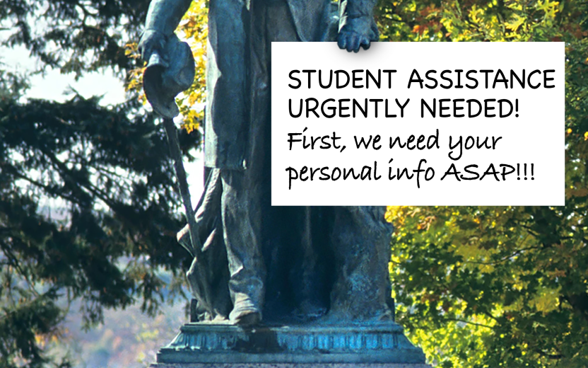 The Ezra statue holds a sign that says student assistance urgently needed. First we need your personal info ASAP.