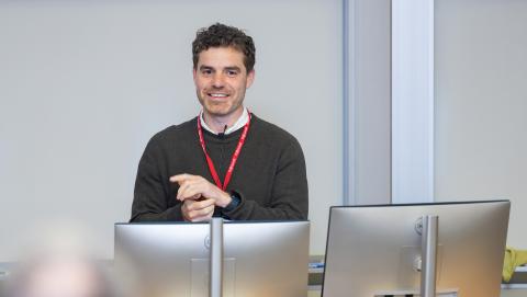 A presenter in the October 15 Emerging Tech Dialogues event engaging the audience with a demonstration.