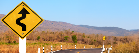 Sign showing a curving road