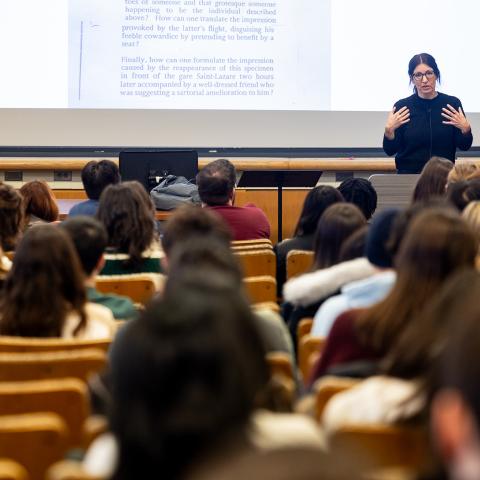 Instructor teaching a large class; © Cornell University, 301 College Ave, Ithaca, NY 14853; 607-255-7675; photo@cornell.edu.