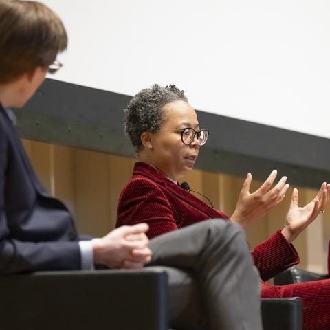 a trio of panelists on a stage
