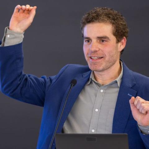 a man speaks from a podium