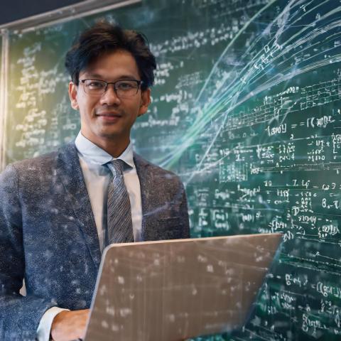 Image generated in Adobe Firefly depicting a professor with a laptop in front of a chalkboard