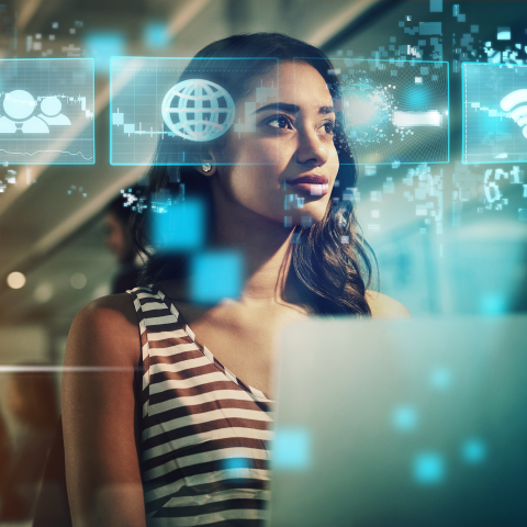 Person at a computer with images of screens around her