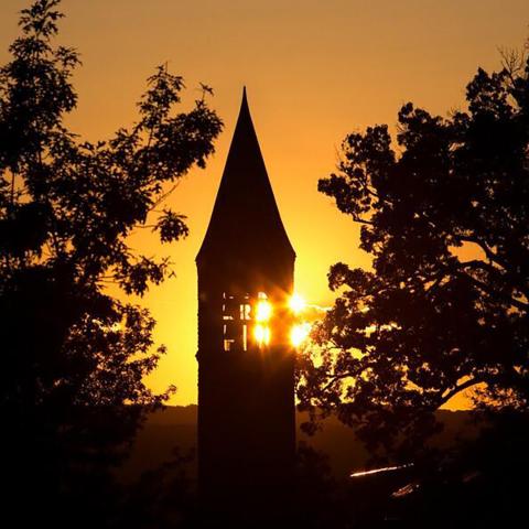 Sunrise over McGraw Tower in fall.