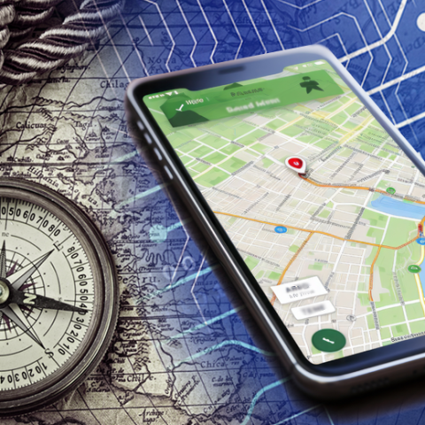 A compass and a smartphone displaying GPS lie on a map that bleeds into binary code and circuitry imagery.